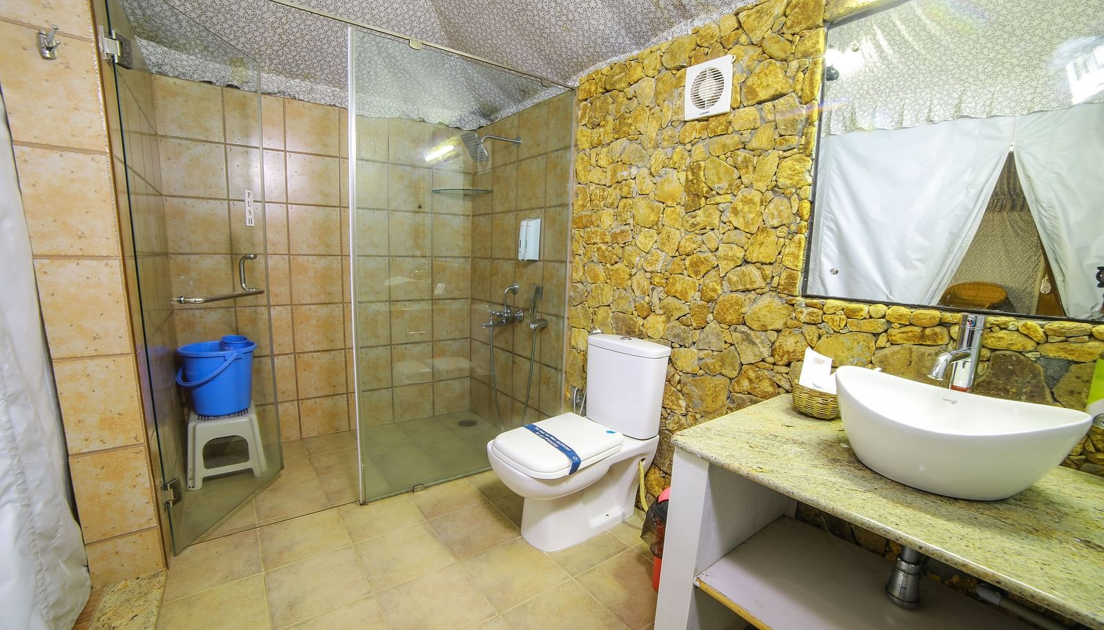 Image of a washroom with a sink and a separate shower cubicle at WOW Bison Woods.