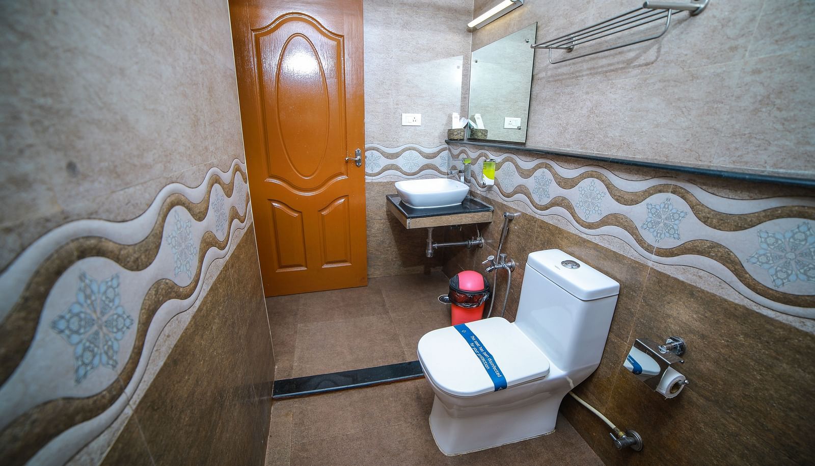 Image of a washroom with a toilet and a sink at WOW Bison Woods.