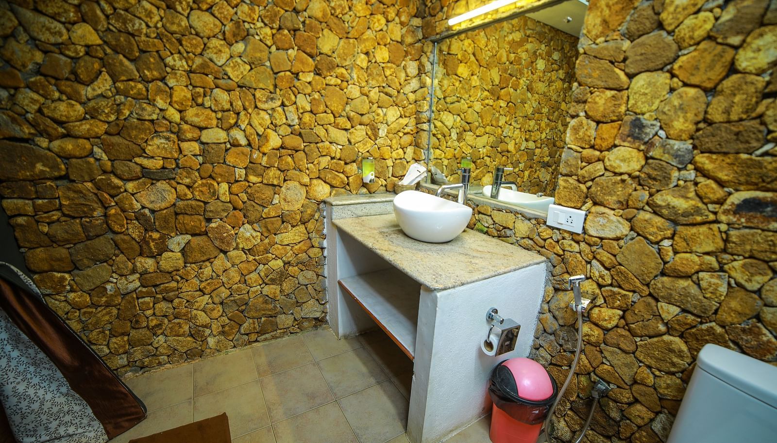 Image of a washroom with a sink and a mirror above it at WOW Bison Woods.