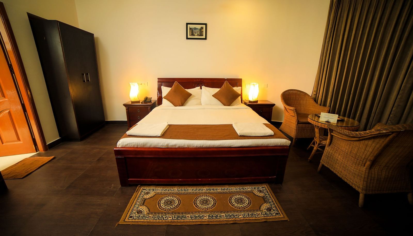 Image of a room with a bed and a wardrobe on the side at WOW Bison Woods.
