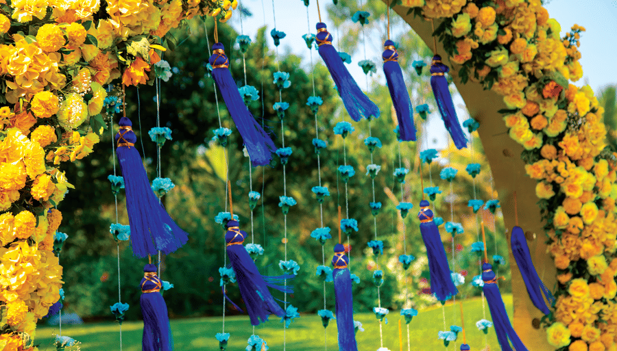 an arch decorated with flowers for a wedding - Caravela Beach Resort Goa