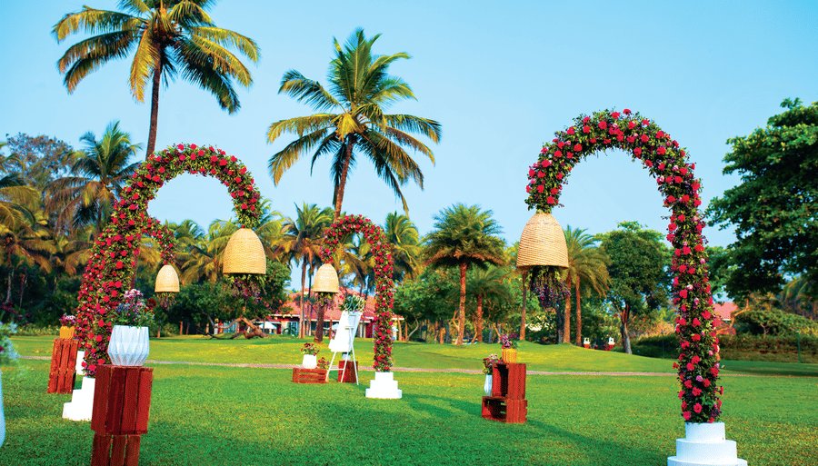 an overview of the lawn area with decorated lamp post - Caravela Beach Resort Goa
