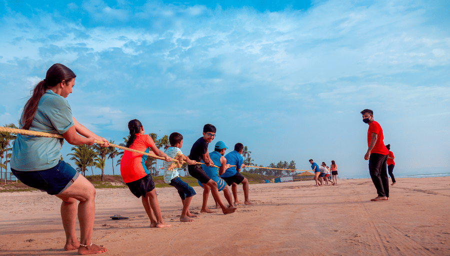 people playing tug o war on the beach - Caravela Beach Resort Goa