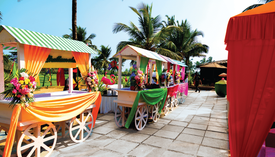 small carts with decorations kept next to each other - Caravela Beach Resort Goa