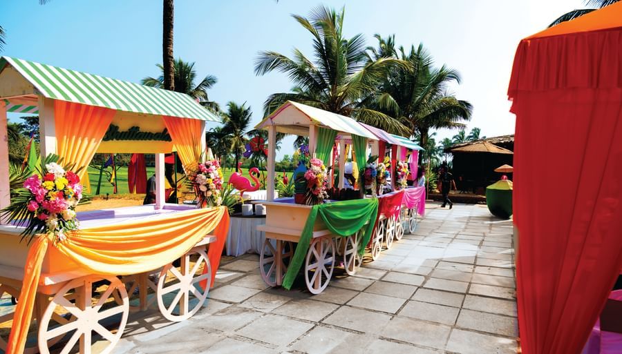 small carts with decorations kept next to each other - Caravela Beach Resort Goa