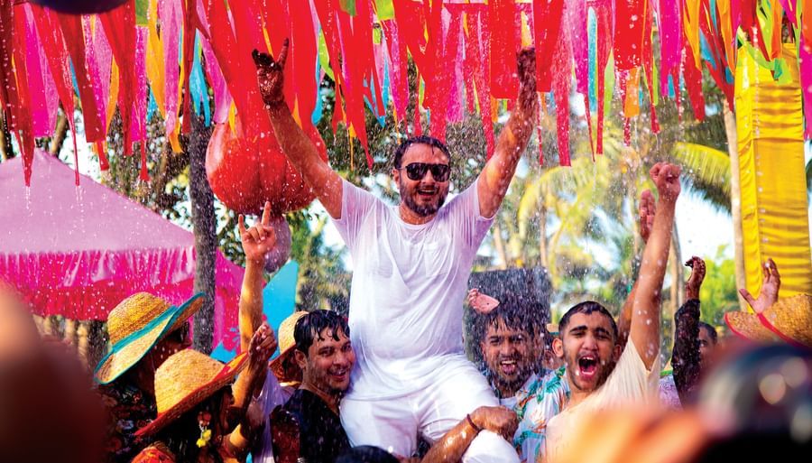 a person being kept on the shoulders of other people celebrating - Caravela Beach Resort Goa