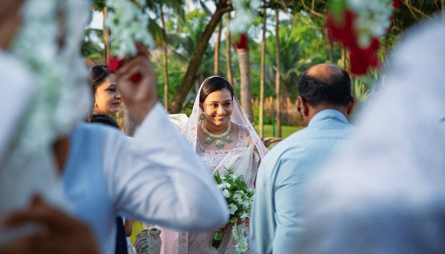 the bride in view smiling during her wedding - Caravela Beach Resort Goa.