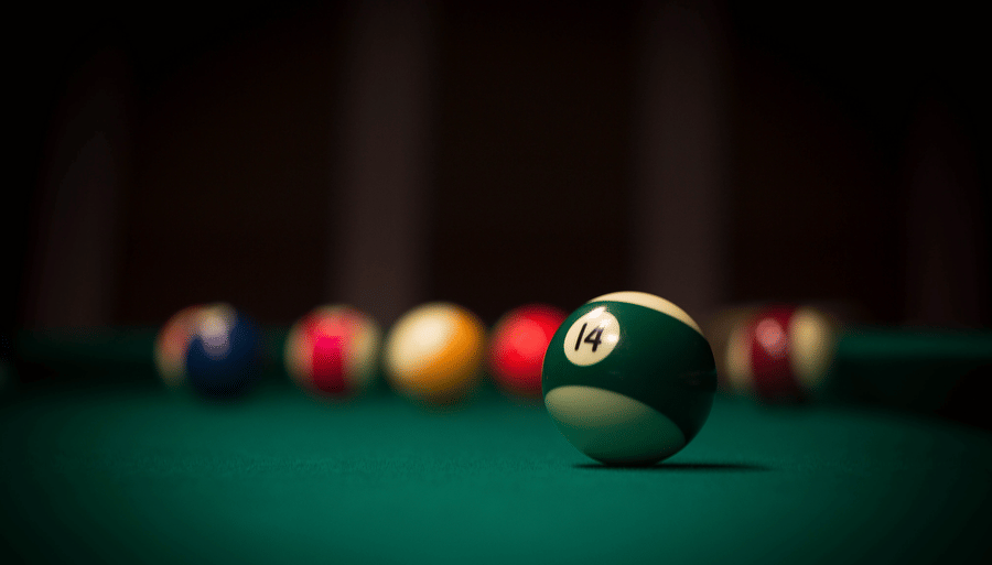 a close up shot of a 14 ball with other balls in the background 
