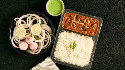 Rajma and Rice served with tangy chuntey and onions