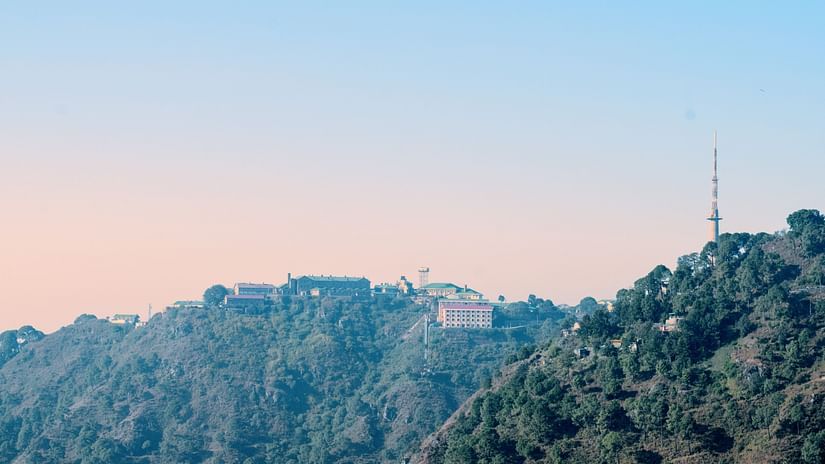 view of the sun setting behind the hills of Kasauli