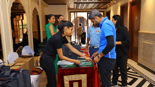 Guests registering at the hotel entrance for the Golf tournament.