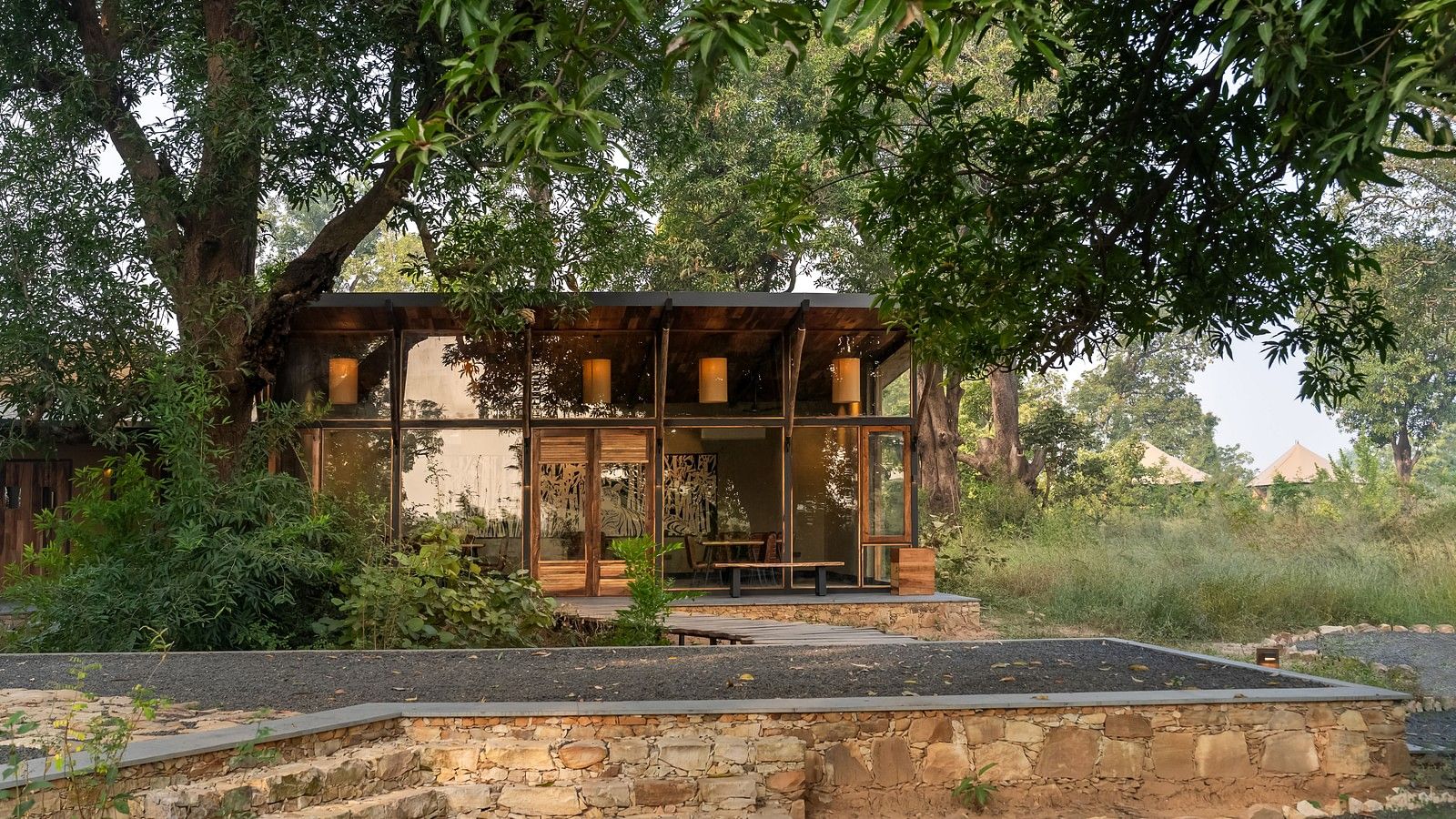 View of a hut amongst greenery at Trees N Tigers, Tadoba.
