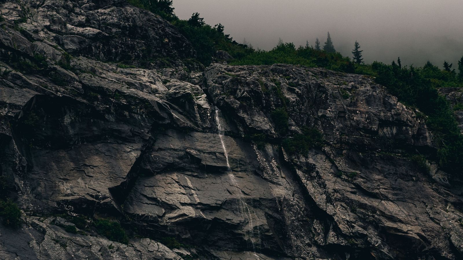 an image of the hillside boulders look majestic during late hours