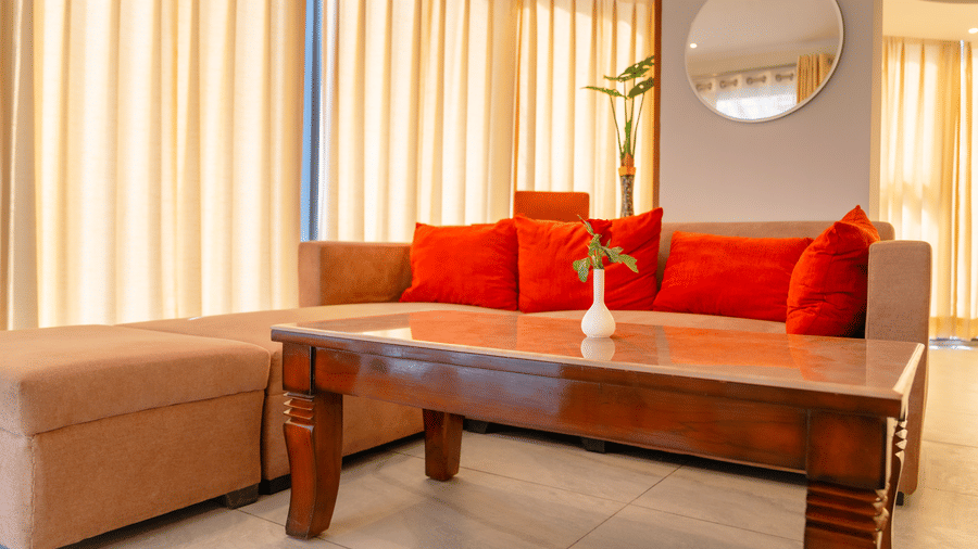 Living area with comfortable sofa of a Standard Room at Montclair Ananta, Elite.