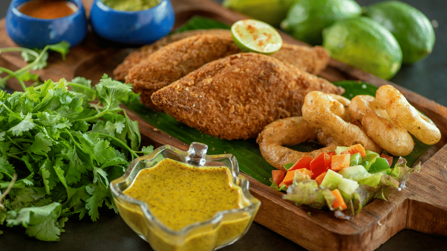 a plate of fish finger with onion rings - polo floatel kolkata