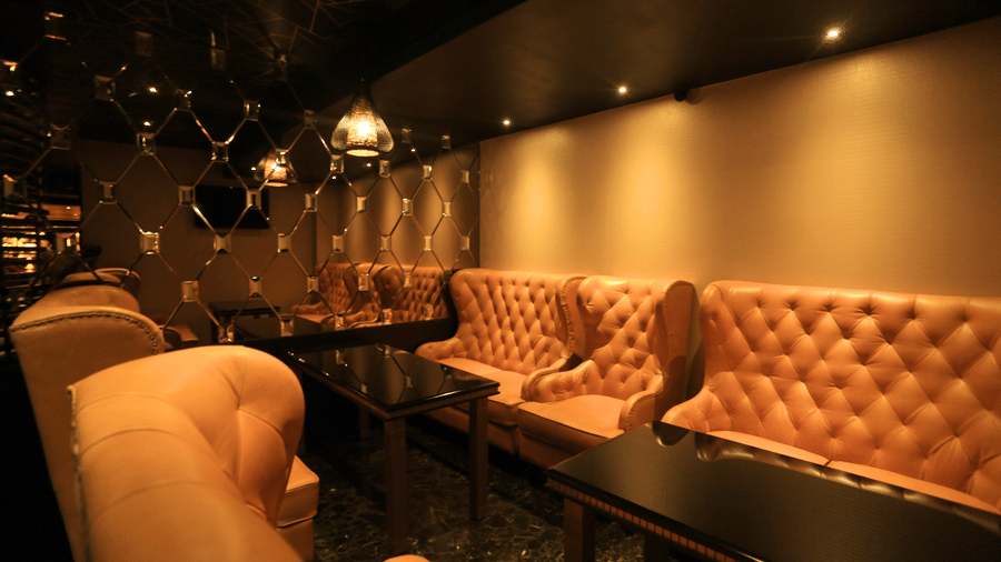 sofas inside the Lounge at Alchemy, our in-house bar in Chennai - Raj Park Hotel, Chennai