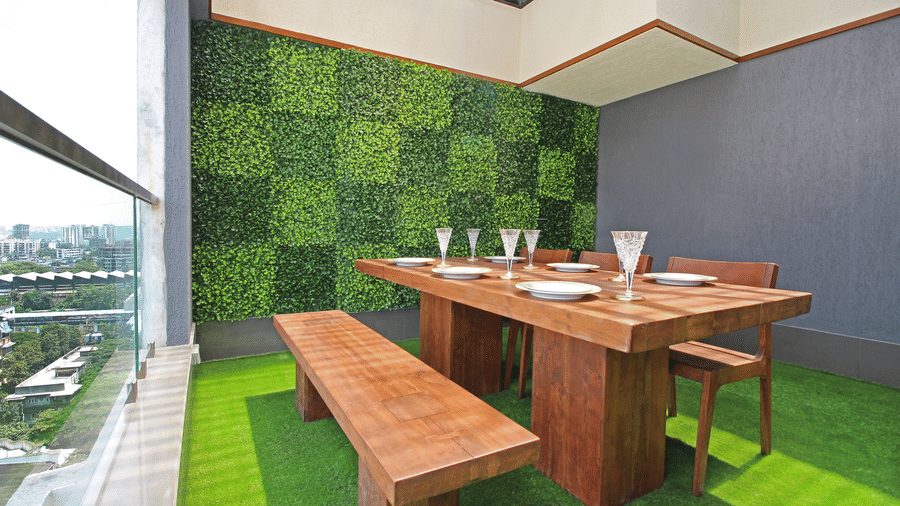 wooden dining table and chairs with picturesque views of the city