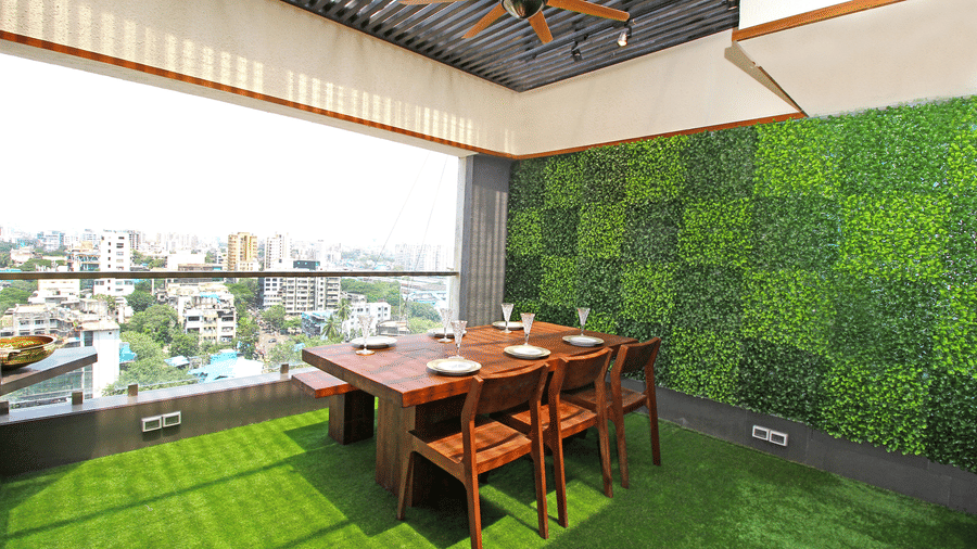 wooden dining table and chairs with picturesque views of the city