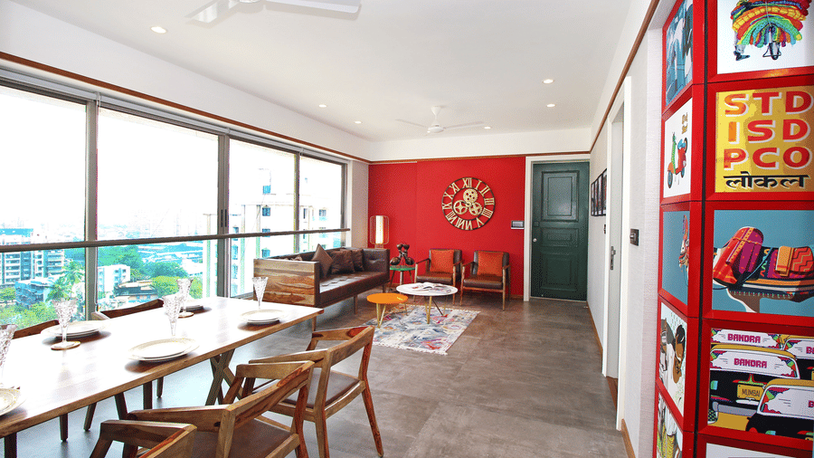 An image of a living room with fancy interiors, cushy sofas and expansive windows overlooking the city at Theory9 - Premium Serviced Apts, Khar