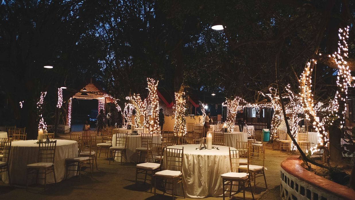 Seating arrangements in an open air setting at The canopy, Capitol Village Resort, Madikeri