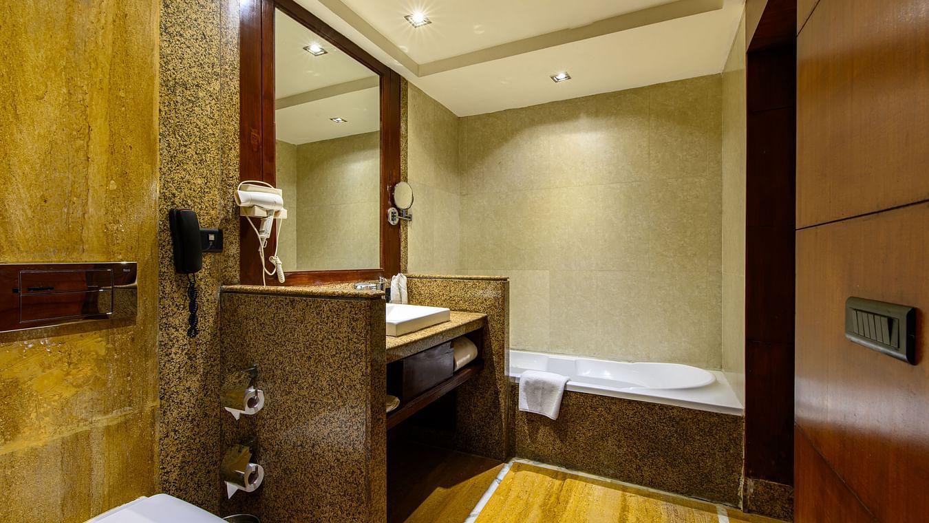 The interiors of a bathroom with a bathtub of one of the rooms in Pushkar at our 5-star resort 