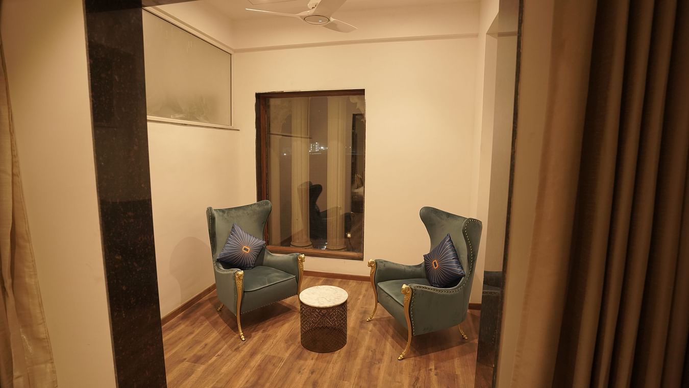 Separate sitting area in room at Classic Sapphire by Ananta