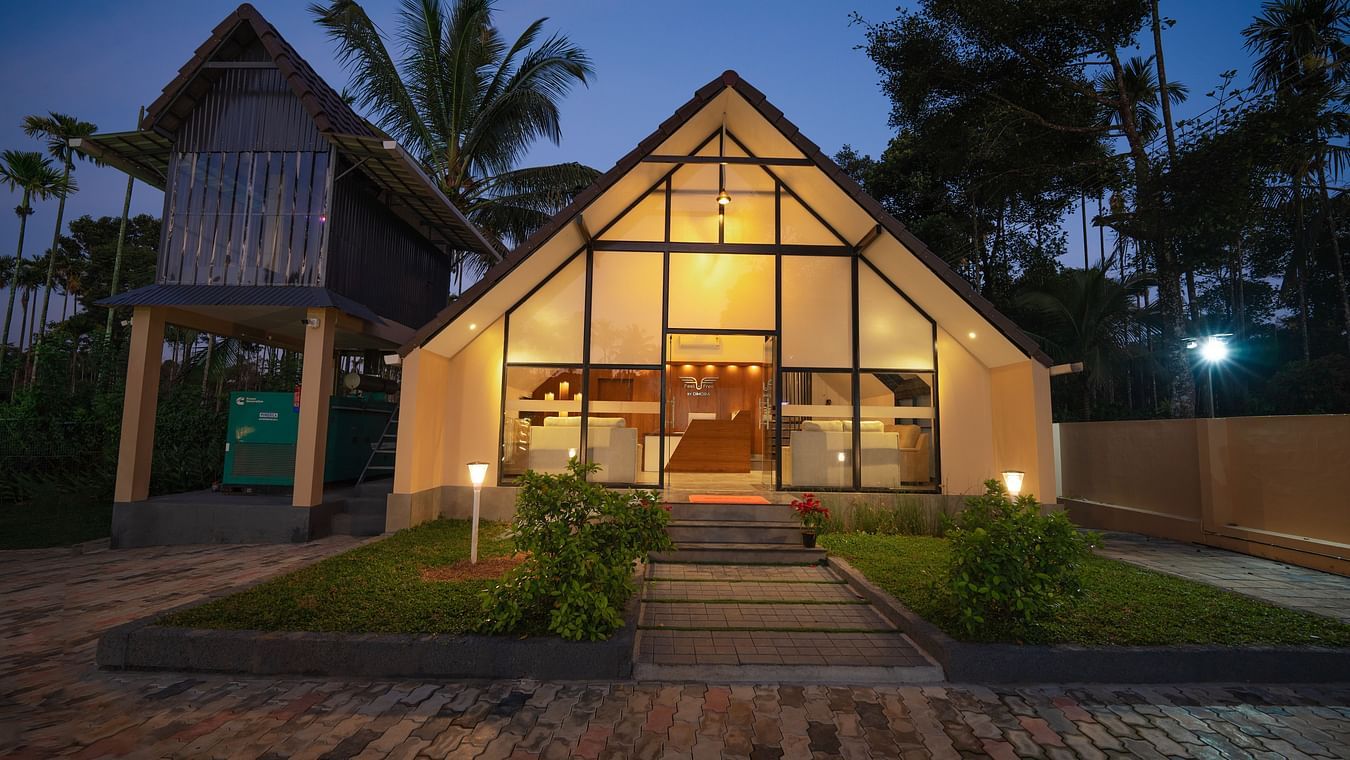 Night view of property with tress behind it at Feel Free Retreat, Wayanad
