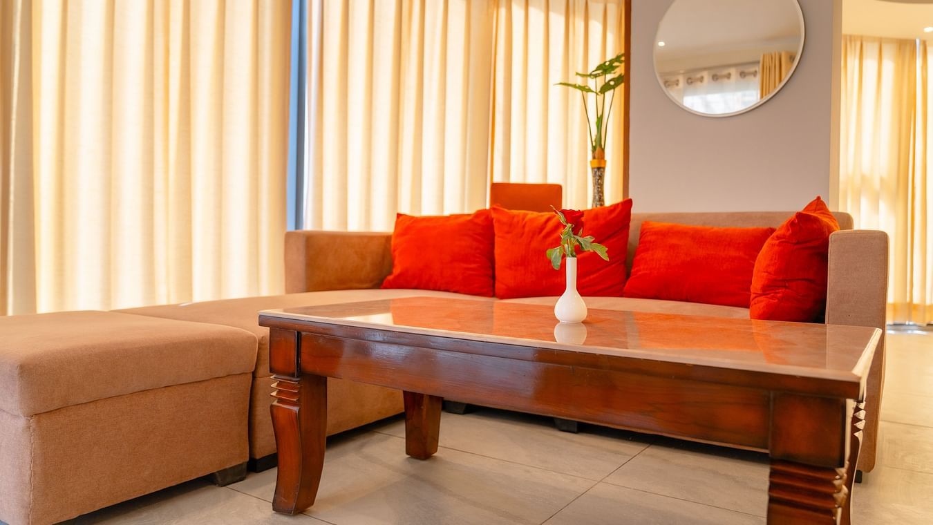 Living area with comfortable sofa of a Standard Room at Montclair Ananta, Elite.