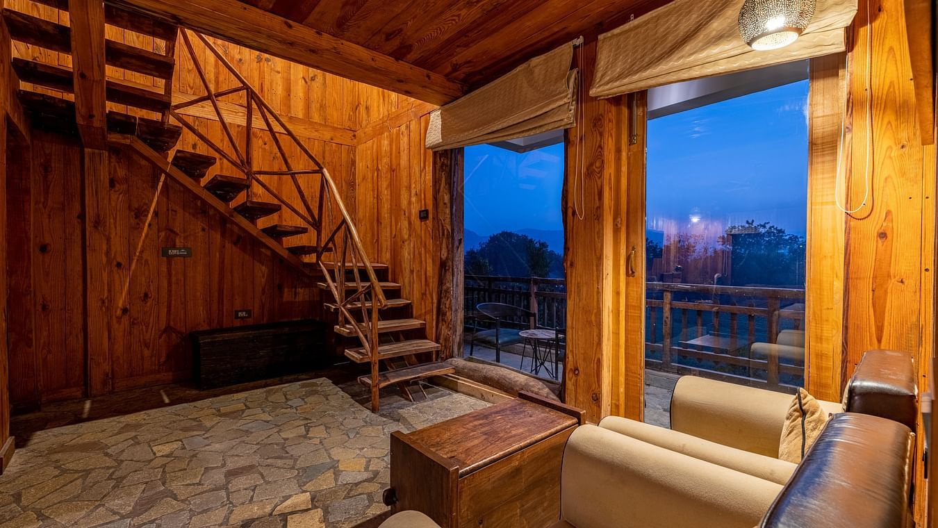 one of the duplex cottages in Ranthambore with a sofa set at one corner