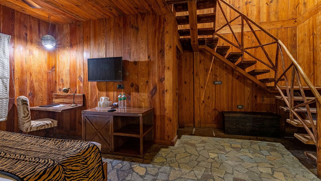 one of the duplex cottages in Ranthambore with a bed at one corner 2