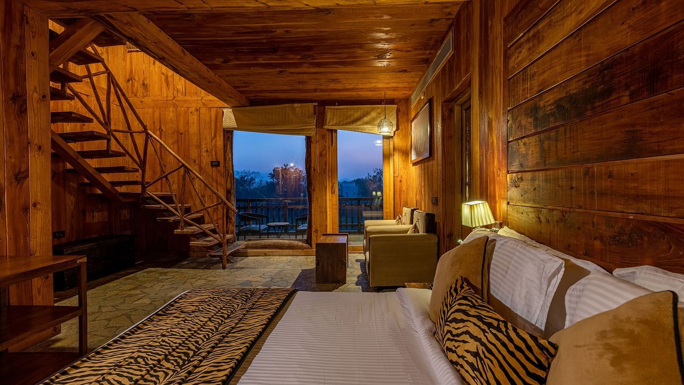 one of the duplex cottages in Ranthambore with a bed at one corner 3