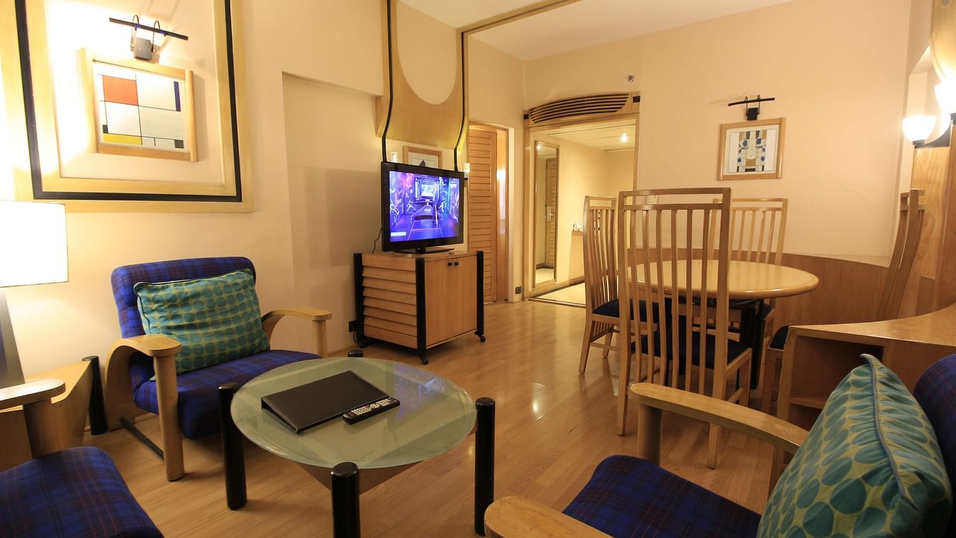 rooms living area with sofa and TV