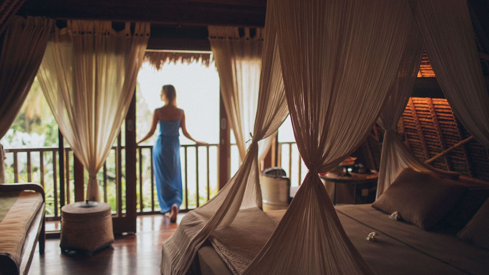 woman looking outside the balcony