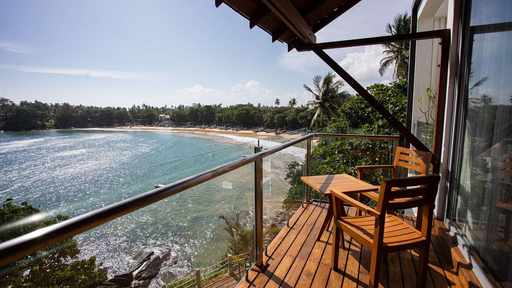 outside view of the sea view superior suite with a beautiful view of the ocean at a bright afternoon at the beacon by the bay villas and suites
