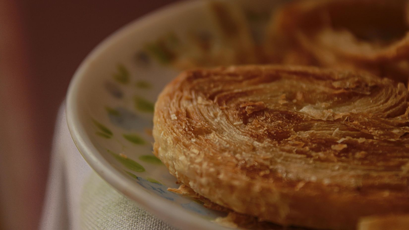 A roasted sweet with a rich brown colour, showing a caramelised surface with a slightly crisp texture
