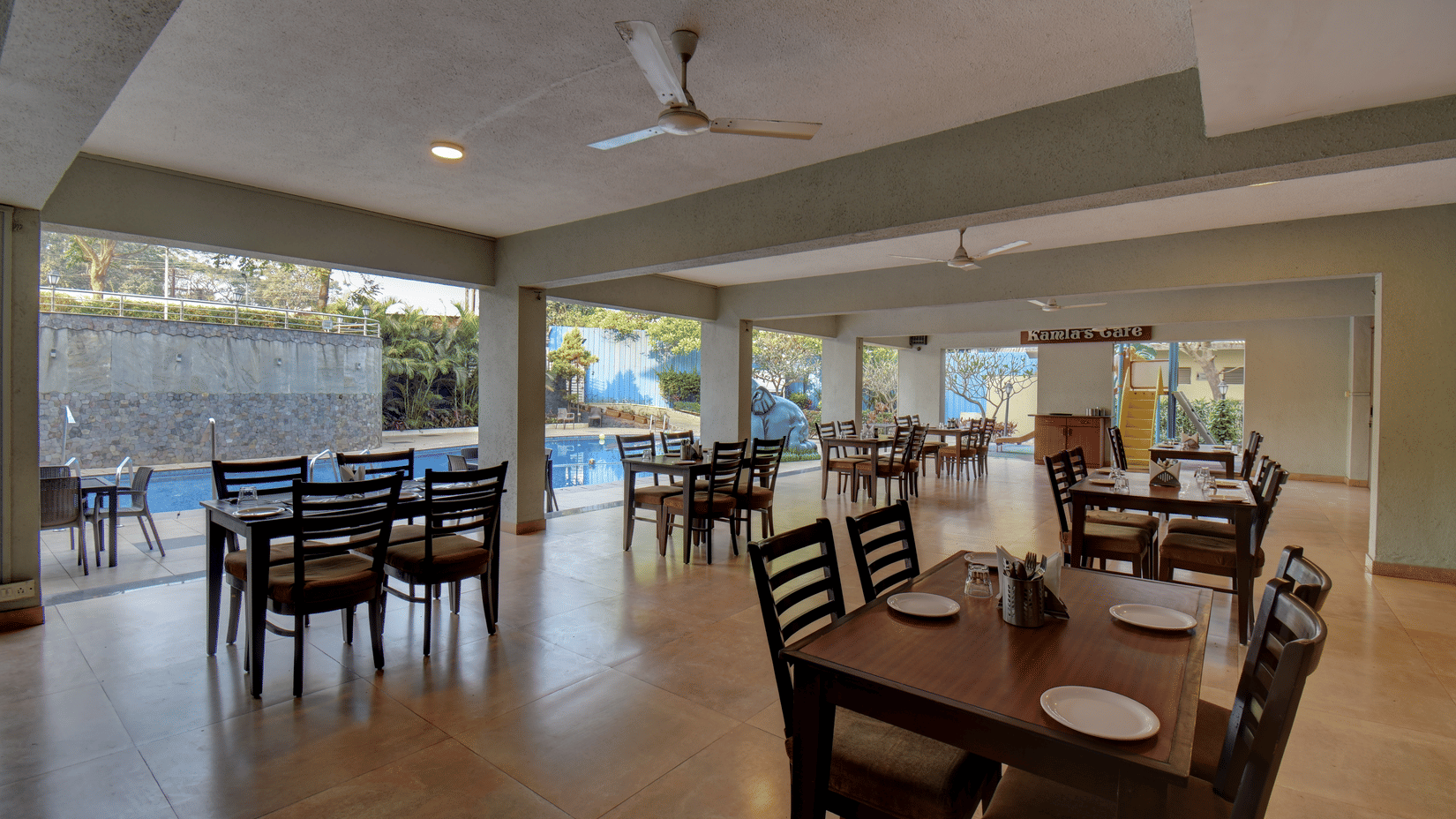 Elegant restaurant interior with comfortable seating and open layout at VITS Lonavala.