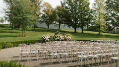 chairs set up on a lawn for a wedding