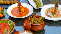 An image of a dining table, adorned with an array of seafood dishes