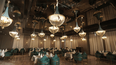 restaurant seating area with blue chairs and white table at Classic Sapphire by Ananta