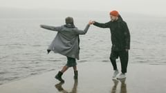 A couple on a rainy beach