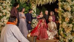 Family gathered around the bride and groom at a wedding ceremony - Heritage Village Resorts & Spa, Manesar