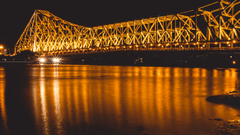 a bridge lit up at night 33