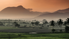 Overview of the nature setting in Coimbatore with rolling hills and mountains in the background