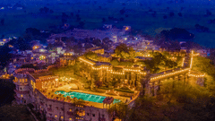 Aerial view image of a fort illuminated with light during night