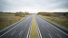 Shot of an empty road and with greenery all around.