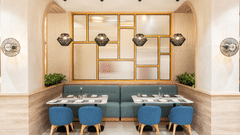 A dining area with blue upholstered chairs and a modern chandelier.