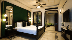 Elegant bedroom with vintage interiors and ceiling fan, offering a luxurious stay - Polo Cherrapunjee Resort