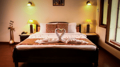 bed with a beautifully decorated towel kept on the bed - Polo Towers, Shillong