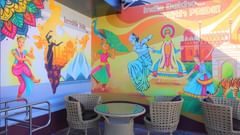 Colourful cafe with beige chairs and table