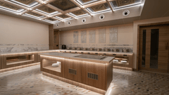 A brightly lit buffet area featuring a central wooden service counter, marble accents, and geometric ceiling lighting | Pride Elite Chhatrapati Sambhajinagar